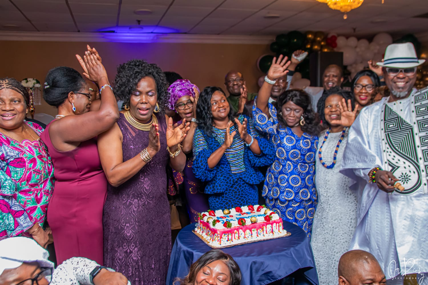 Members clapping and singing in celebration